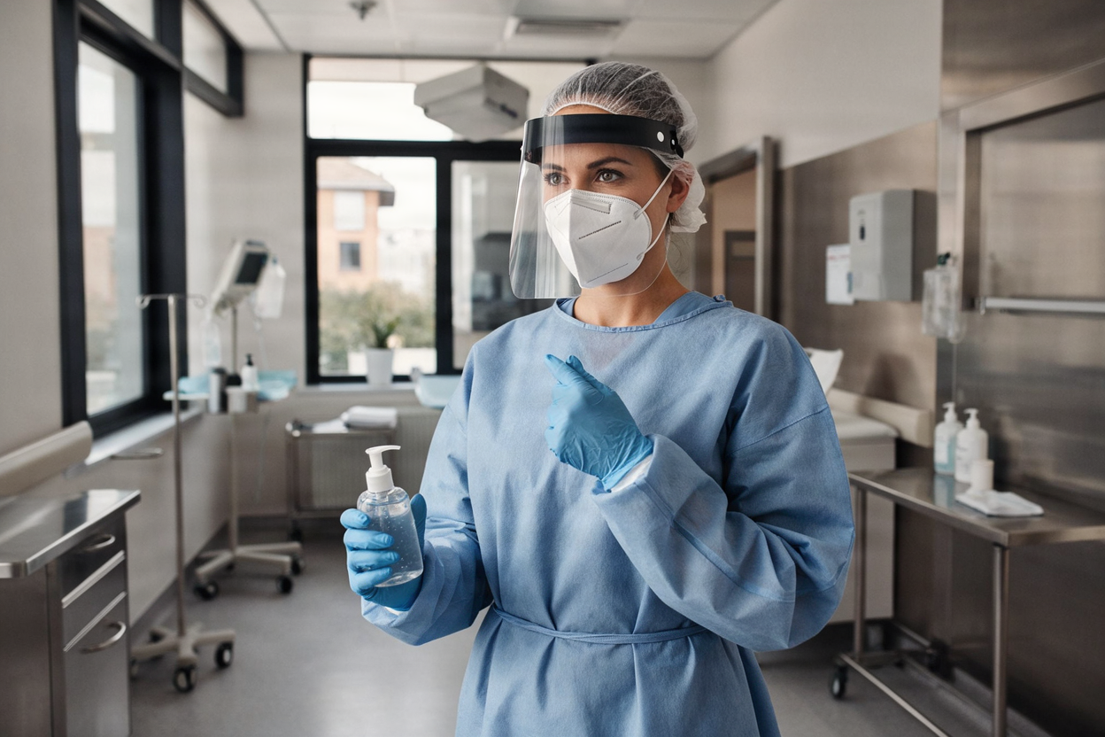 Healthcare worker wearing full personal protective equipment (PPE).